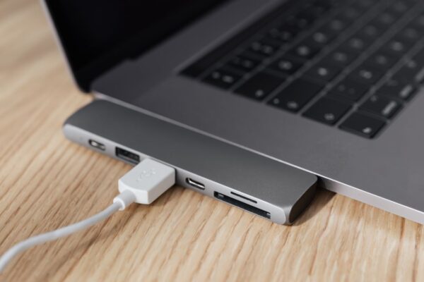 Universal USB-C docking station hub connected to laptop | Khaleej Electronics Dubai